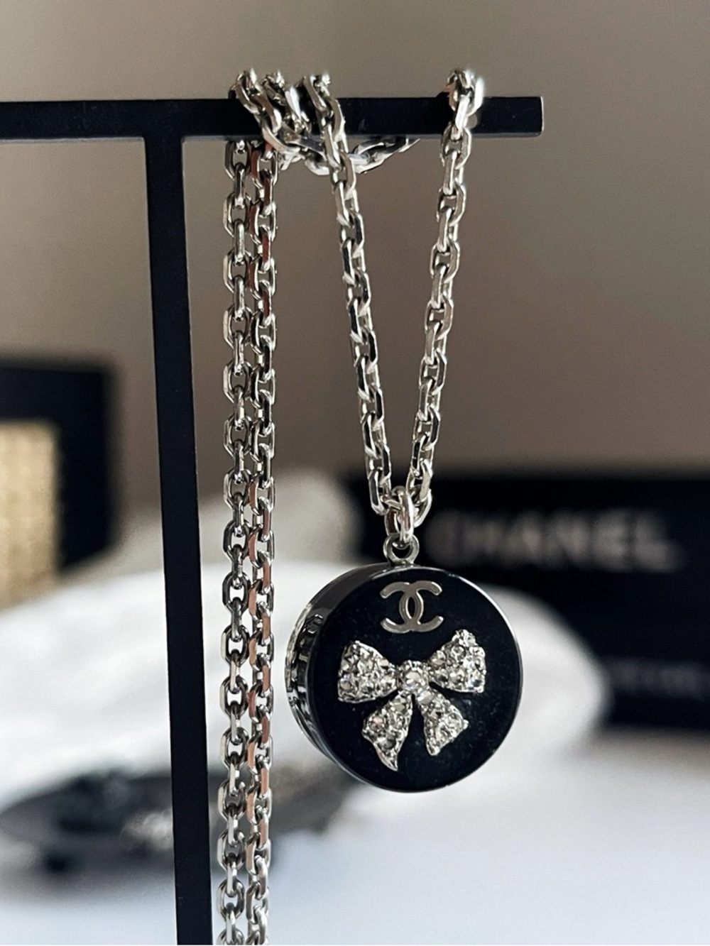 CHANEL Black and Silver Crystal Bow Pendant Necklace